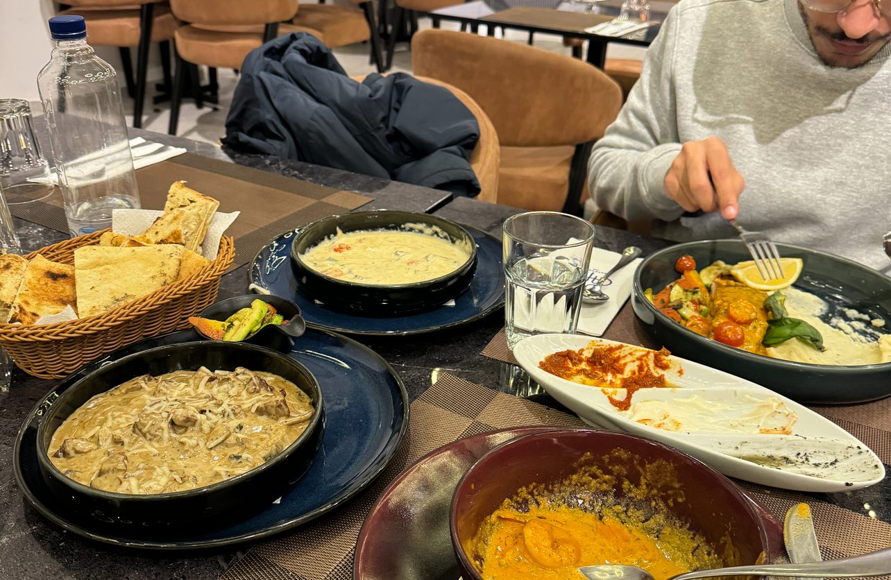 A shared lunch spread across a restaurant table
