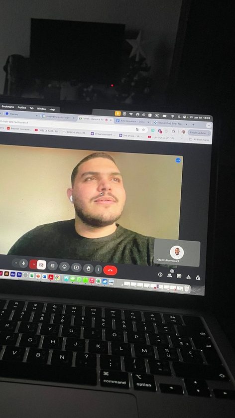 A laptop on a video call with a teammate